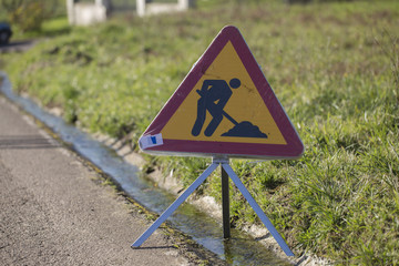 Roadworks sign in a village
