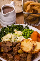 Beef in Irish Stout Stew
A dish of Beef in Irish stout with a topping of sliced potatoes.