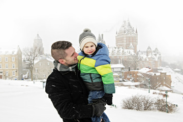 Father And Son In Snowy Landscape