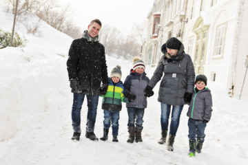 family and their son spending time outdoor in winter