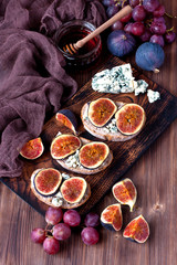 Juicy flavorful  figs, grape  and cheese  on bread