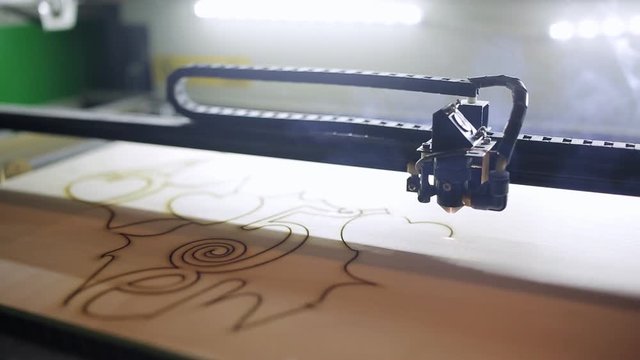 A machine for cutting plywood with a laser