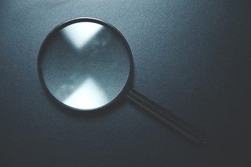 Magnifying glass on dark background