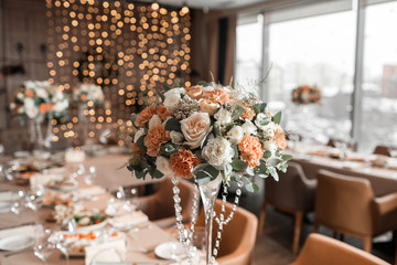 Decorated table in the restaurant, the preparation before the banquet. the work of professional florists.