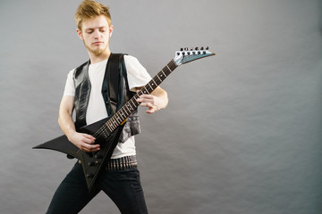 Fototapeta premium Man playing on electric guitar