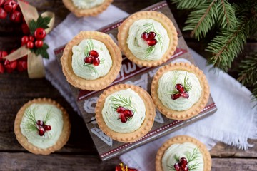 Tartlets with avocado pasta, cottage cheese, fish caviar and pomegranate.