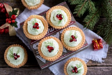 Tartlets with avocado pasta, cottage cheese, fish caviar and pomegranate.