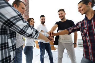 business team with hands clasped together