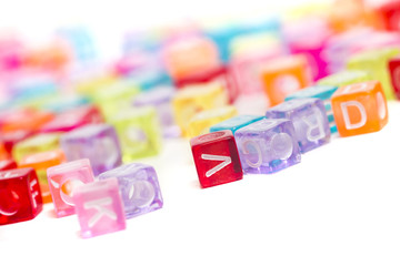 Colorful plastic beads with letters