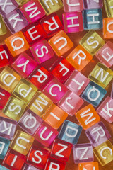 Colorful plastic beads with letters