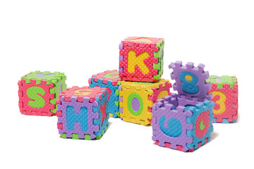 Fototapeta na wymiar Foam puzzle letter cubes