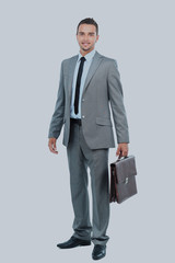 Full body portrait of happy smiling business man, isolated on white background.