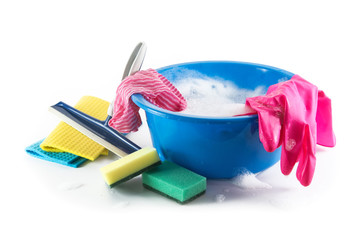 Spring cleaning, blue plastic bowl with soap foam and colorful household utensils such as cleaning cloth, sponges and rubber gloves, isolated with shadow on a white background, copy space