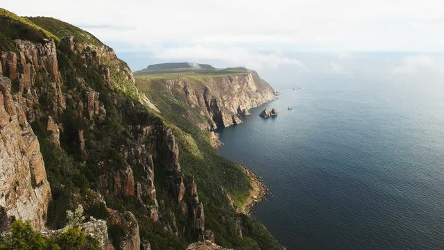 afternoon view of summer sea fog and cape raoul a part of the three capes experience in tasmania, australia