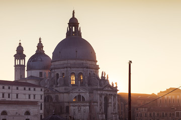 Sun setting behind the Basilica della Salute, Venice, Italy