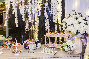 Delicious wedding reception candy bar dessert table
