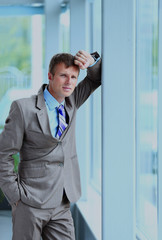 Fototapeta premium Portrait of a businessman looking at the window.