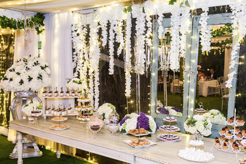 Delicious wedding reception candy bar dessert table