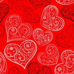 Seamless pattern of big hearts with ornament of curls, flowers and leaves, white and black on red
