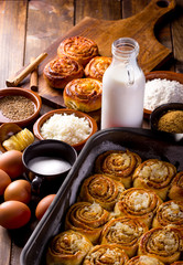 Table full of ingredients for the preparation of cinnamon rolls with cheese. golfeados desserts typical in Venezuela.