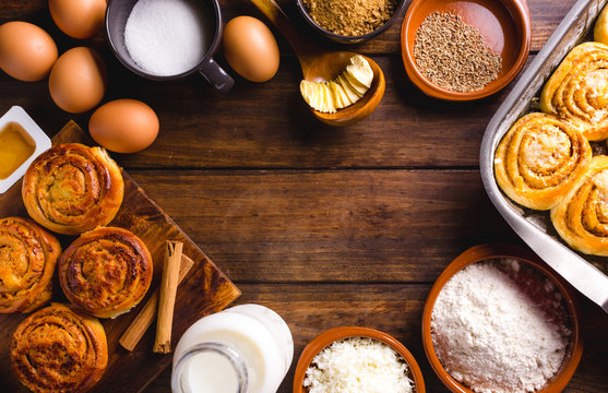 Table full of ingredients for the preparation of cinnamon rolls with cheese. golfeados desserts typical in Venezuela.