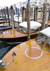 Water taxi speedboats moored in the canal in Venice, 2017.