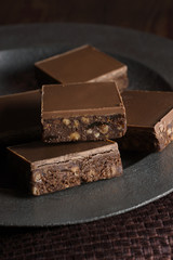 Tiffin or fridge cake a confection made with cocoa crushed biscuit dried fruit and melted chocolate...