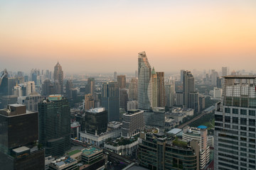 Fototapeta na wymiar Modern building in Bangkok business district at Bangkok city with skyline before sunset, Thailand.