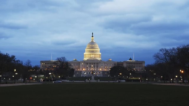 a dusk view of the west side of the us capitol building from the mall in washington d.c.