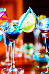 Tasty and colorful drinks based on various alcohols, syrups and liqueurs, unique effect of the bartender's work