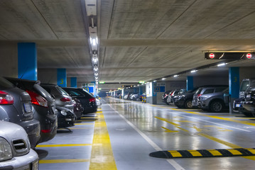 Large multi-storey underground car parking garage - Powered by Adobe