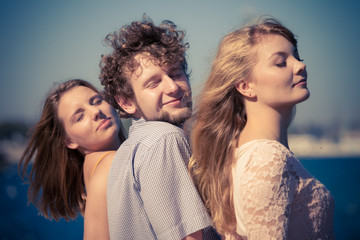 Fototapeta premium Group friends boy two girls having fun outdoor