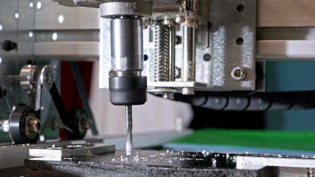 CNC milling machine proceccing plastic detail.Cutting plastic  modern processing technology.