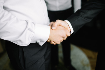 Obraz premium man's handshake close up