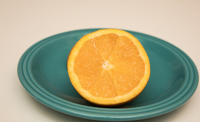 orange on blue plate