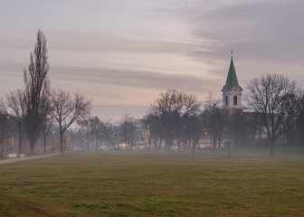 Jedlesee Aupark and church on a misty winter morning