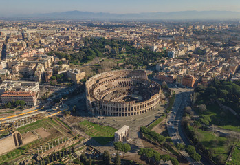 Fototapeta na wymiar Aerial view of Colosseum at sunny day. Rome, Italy