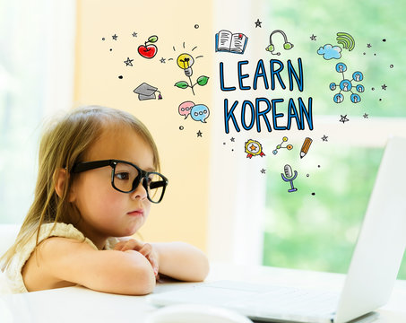 Learn Korean text with little girl using her laptop