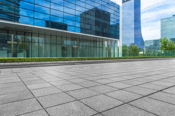 modern glass building exterior with empty pavement