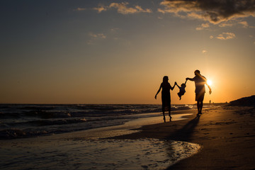 Family beach silhouette - Powered by Adobe