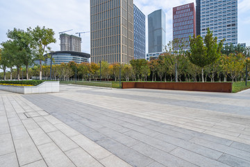 modern glass building exterior with empty pavement