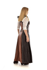 full length portrait of girl wearing brown  fantasy costume.. standing pose with back to the camera on white studio background. 