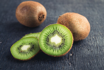 Fresh Kiwi Fruit on Blackboard Background