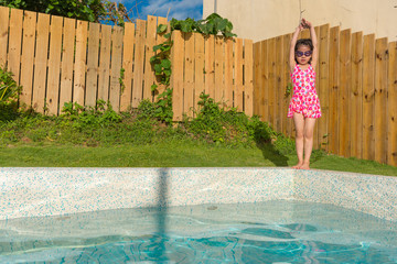cute pretty little girl kid making swimmer posing