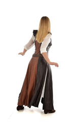 Fototapeta premium full length portrait of girl wearing brown fantasy costume, standing pose with back to the camera on white studio background. 