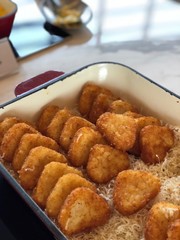 Tray of hash browns shot in portrait 