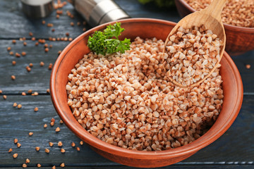 Eating of tasty buckwheat porridge