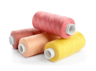 Set of sewing threads on white background