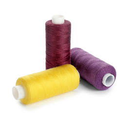 Set of sewing threads on white background