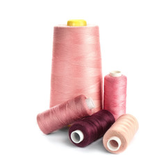 Set of sewing threads on white background
